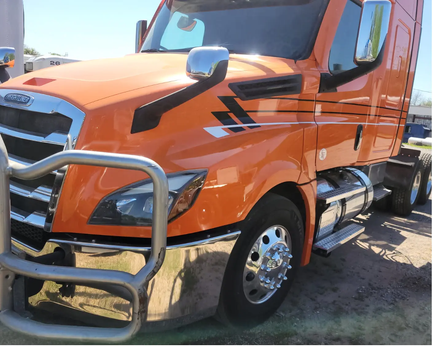 Orange Freightliner with stripes